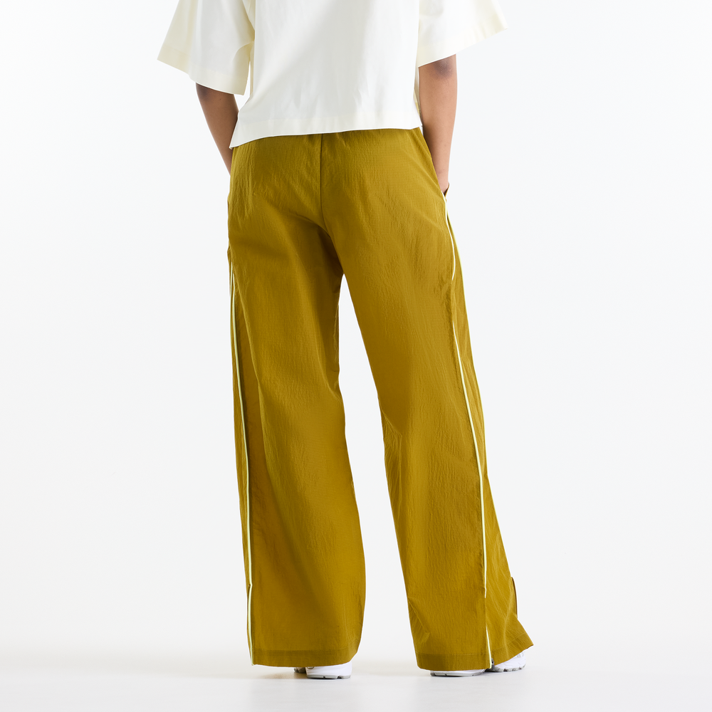 Dámske nohavice New Balance Sport Legacy – žlté
