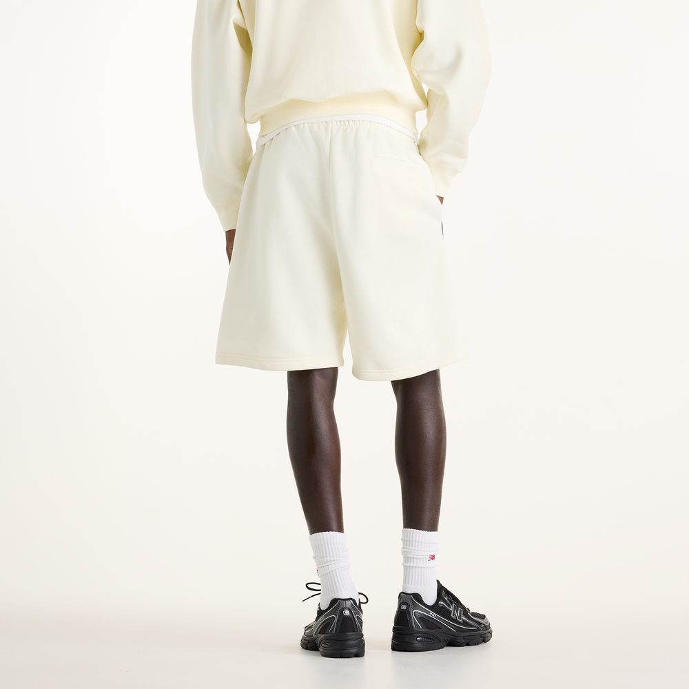 Pánske šortky New Balance Sport Linear Graphic – béžové