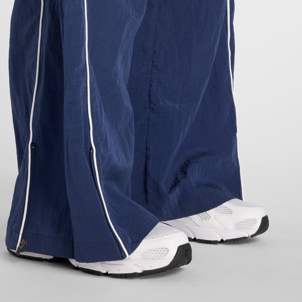 Dámske nohavice New Balance WB61Z1E6NNY – tmavomodrá