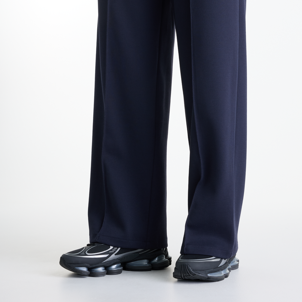 Dámske nohavice New Balance Sport Legacy – tmavomodrá