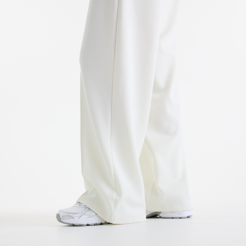 Dámske nohavice New Balance Sport Legacy – biele