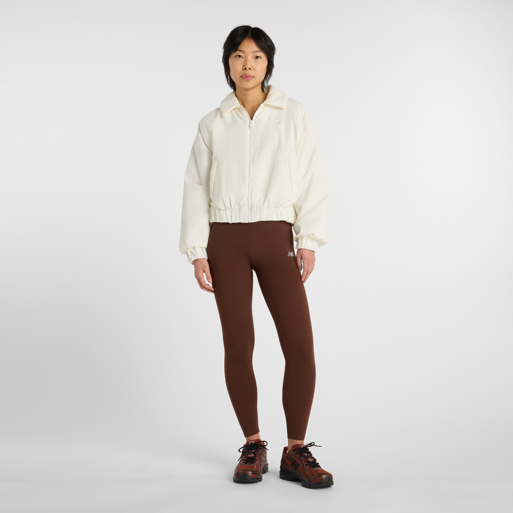 Dámska bunda New Balance WJ61D8YXSST​ – béžové