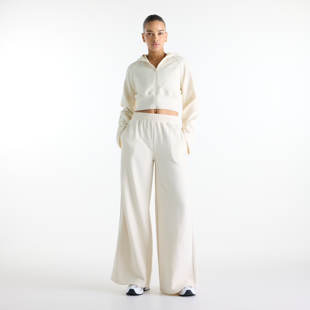 Dámske nohavice New Balance Brushed Coastal – béžové