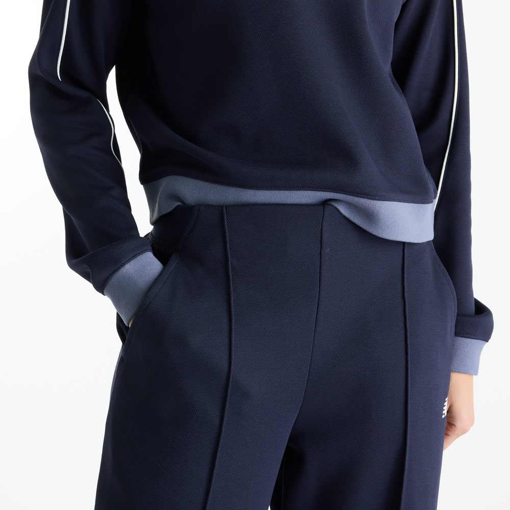 Dámske nohavice New Balance Sport Legacy – tmavomodrá