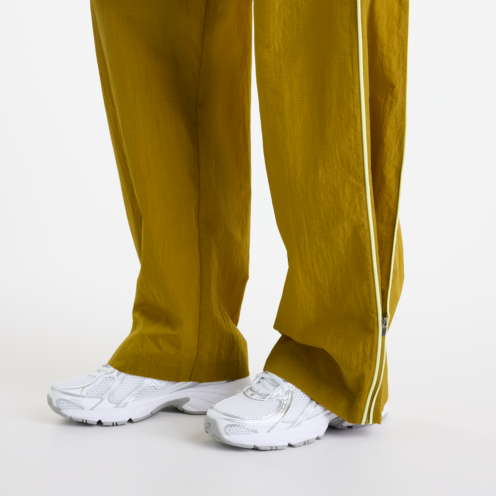 Dámske nohavice New Balance Sport Legacy – žlté