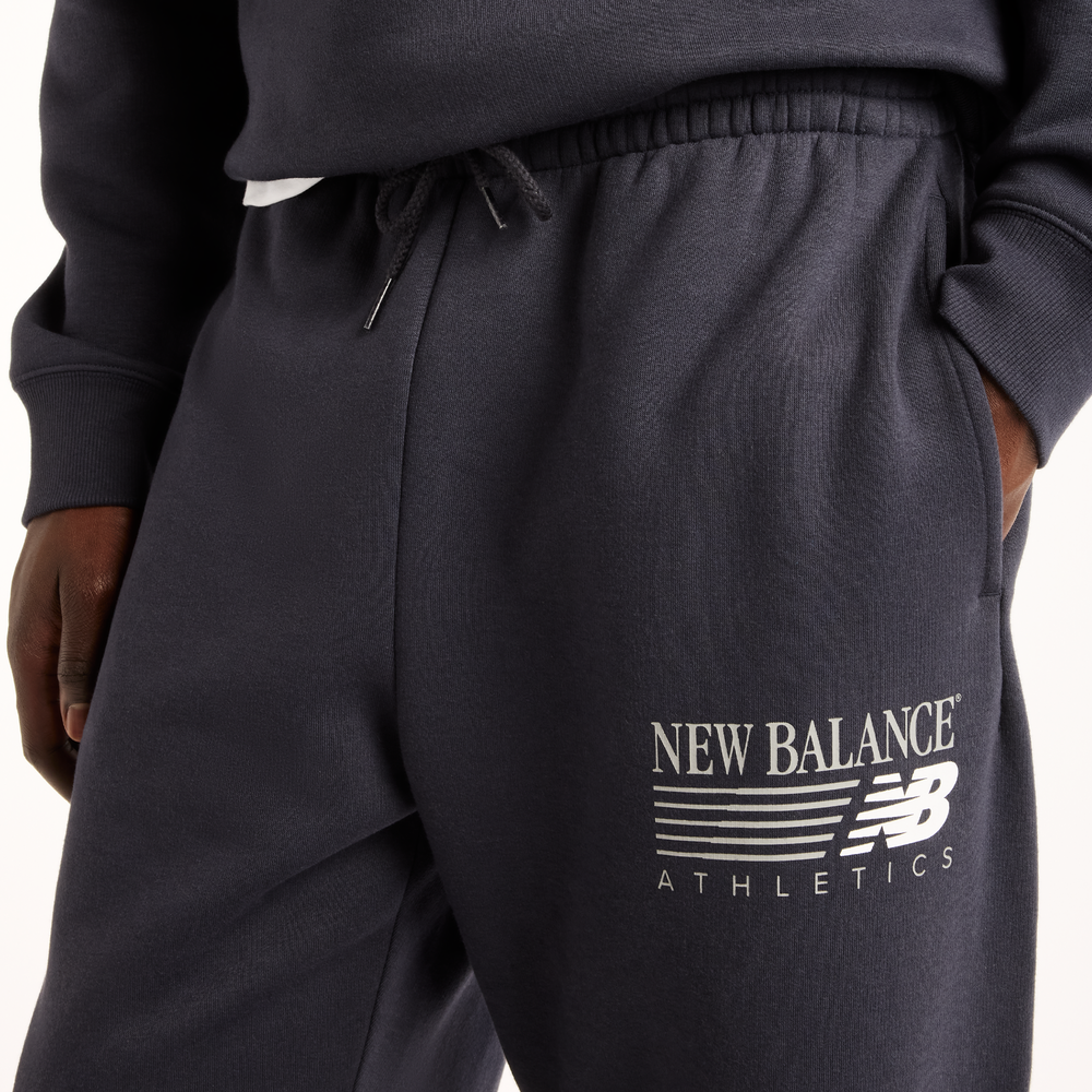 Pánske nohavice New Balance Reimagined Graphic – sivé