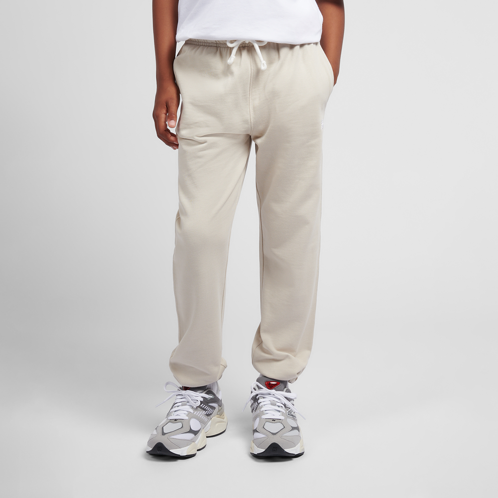 Detské nohavice New Balance LAKB0060TWF – béžové