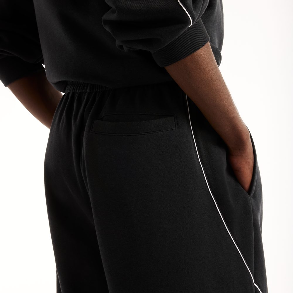 Pánske nohavice New Balance Trackside Pants – čierné