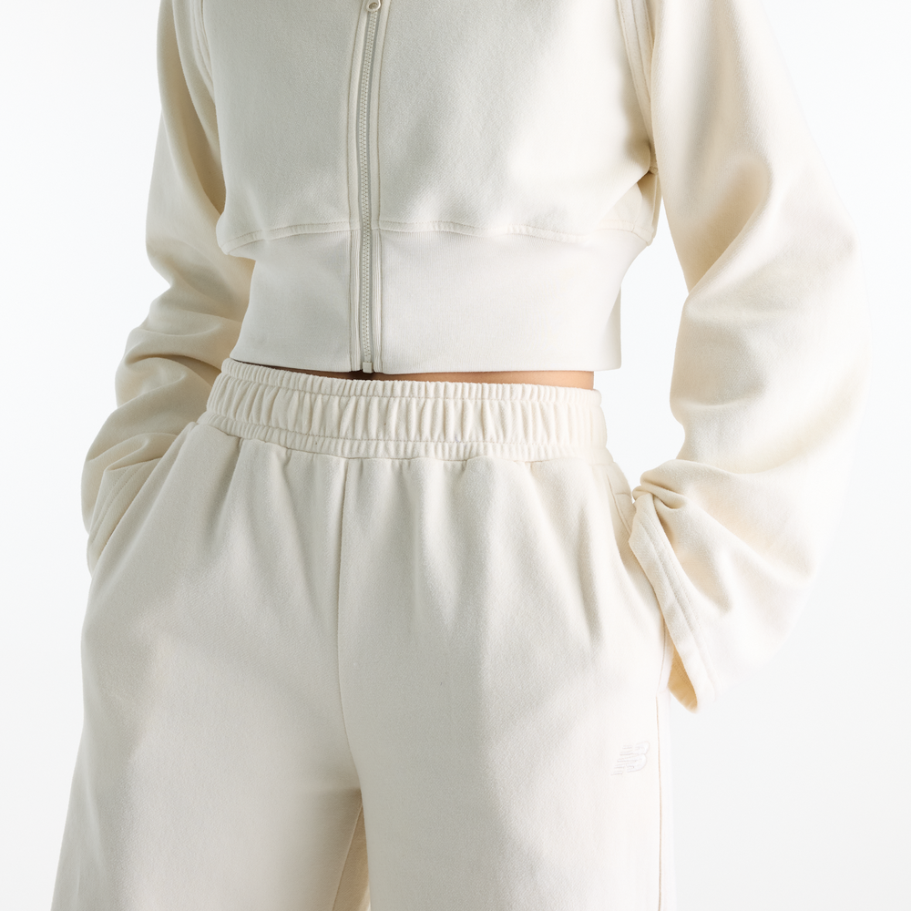 Dámske nohavice New Balance Brushed Coastal – béžové