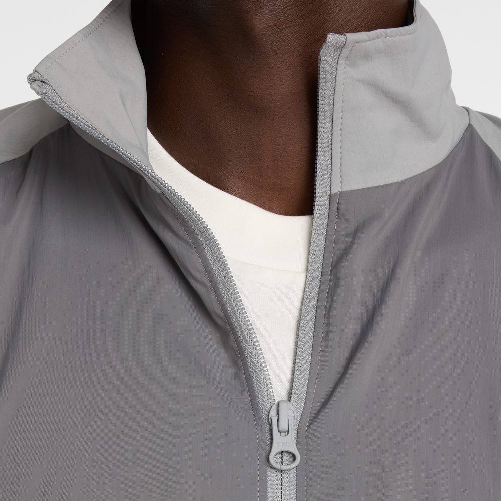 Pánska bunda New Balance MJ61J73YCAS – sivé