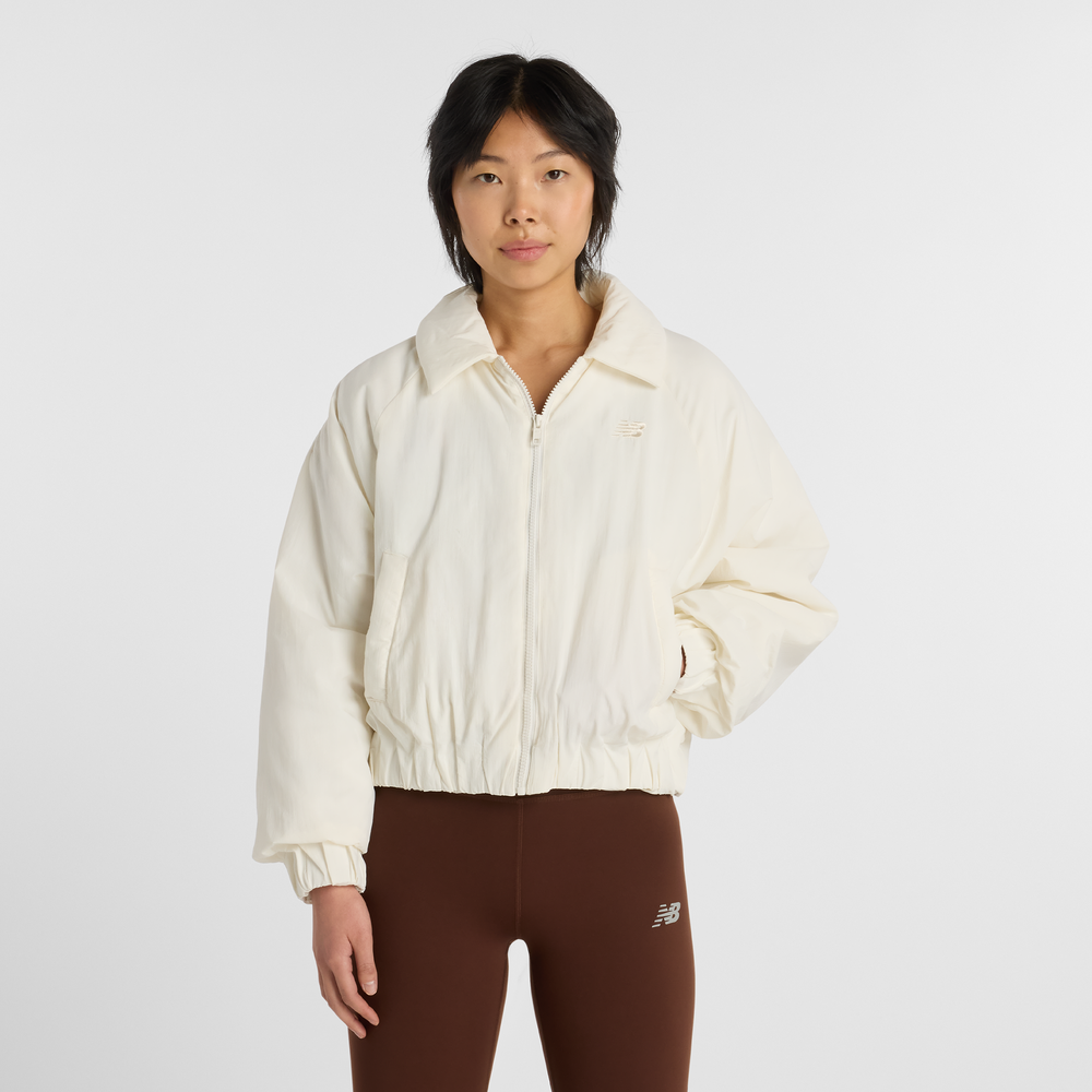 Dámska bunda New Balance WJ61D8YXSST​ – béžové