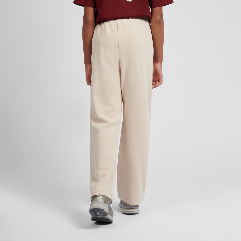 Detské nohavice New Balance LAKG0216BIS – béžové