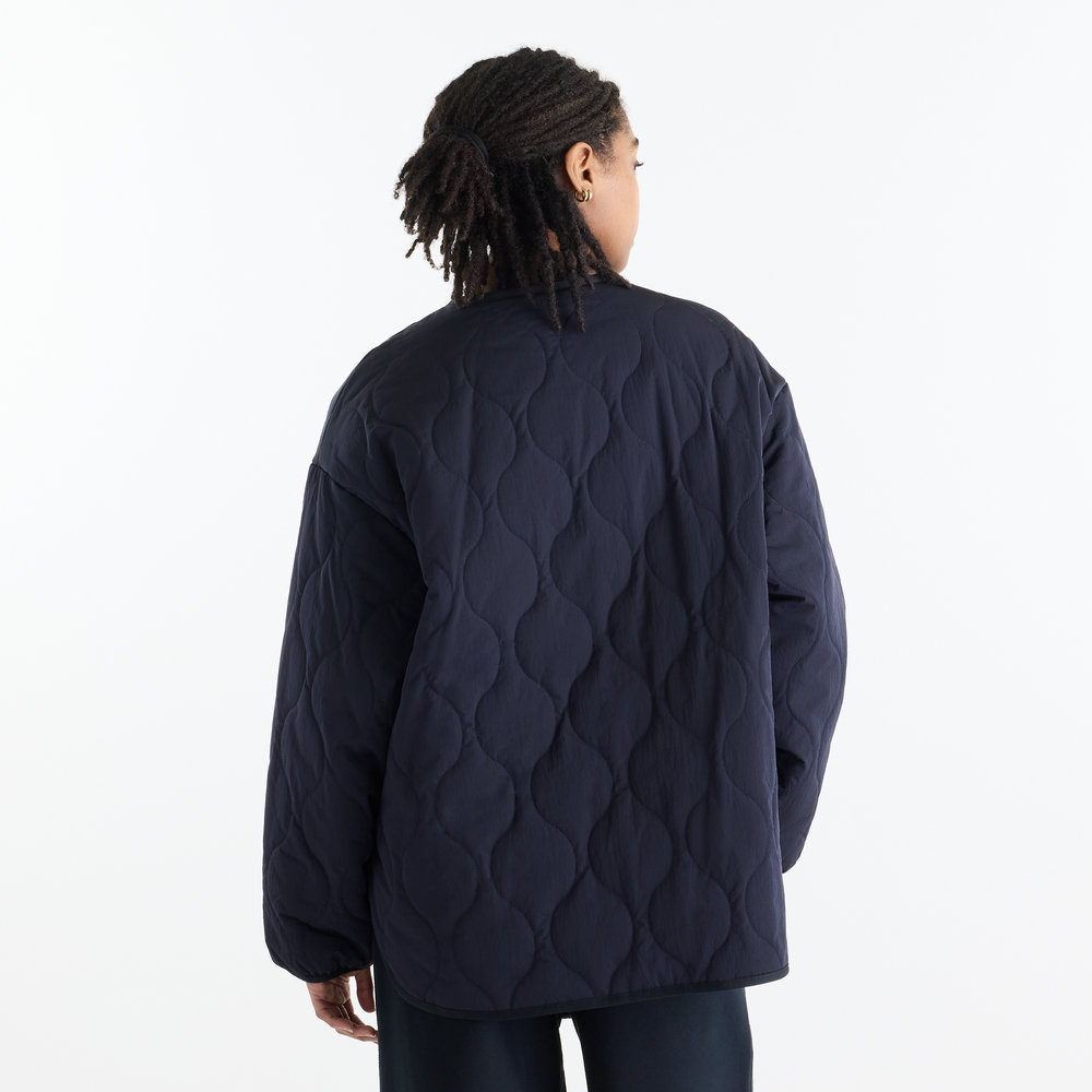 Dámska bunda New Balance Quilted Bomber – tmavomodrá