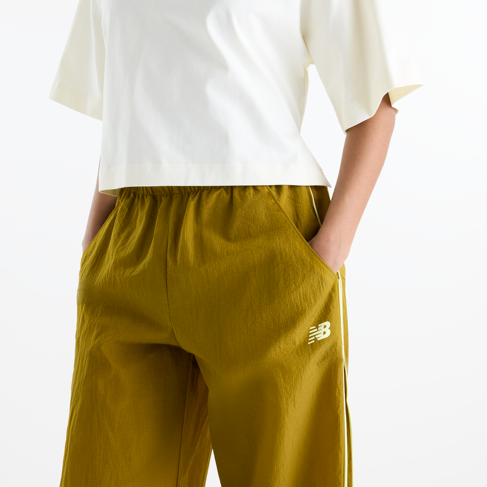 Dámske nohavice New Balance Sport Legacy – žlté