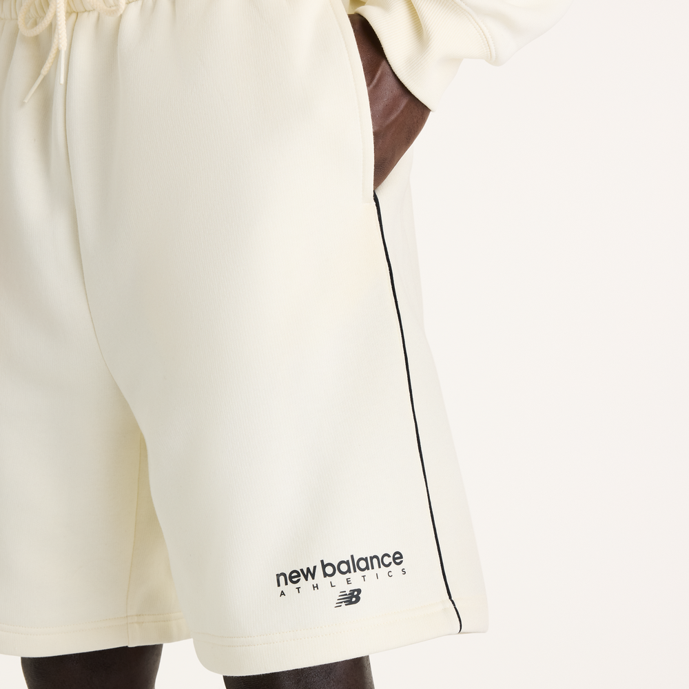 Pánske šortky New Balance Sport Linear Graphic – béžové