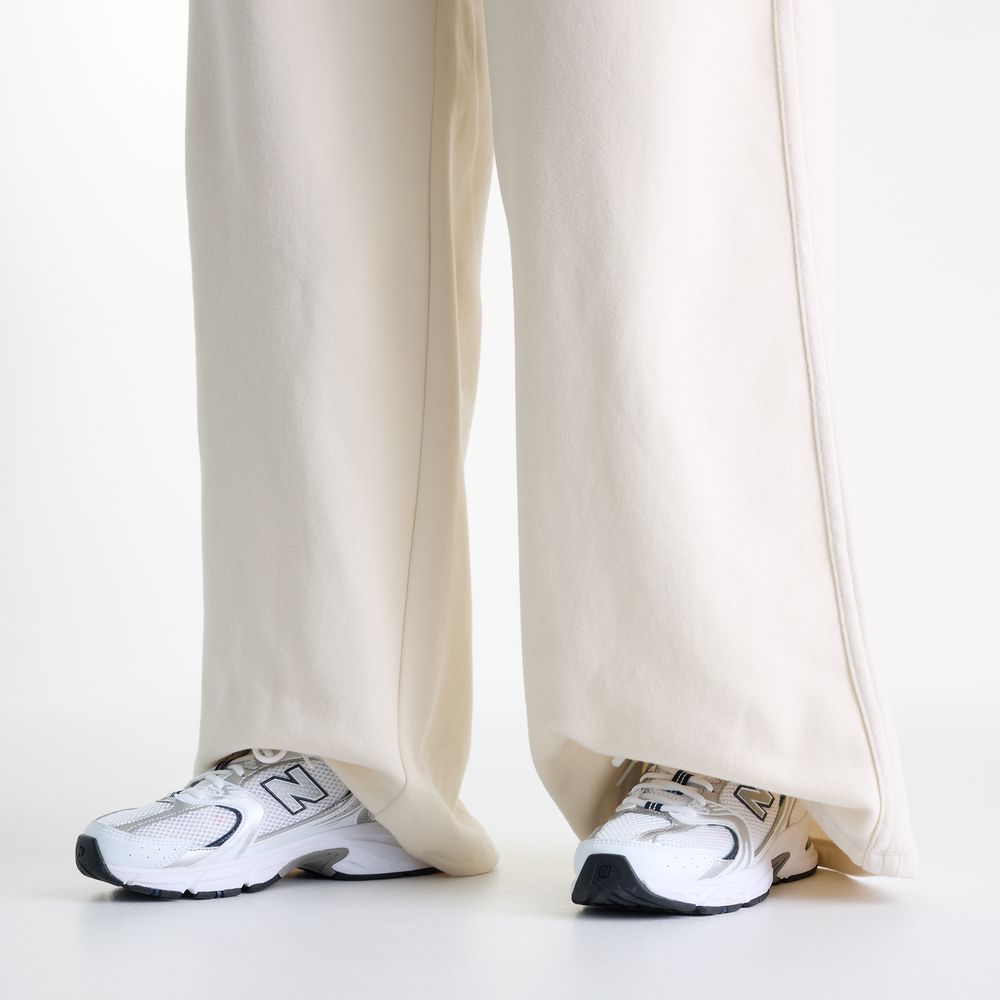 Dámske nohavice New Balance Brushed Coastal – béžové