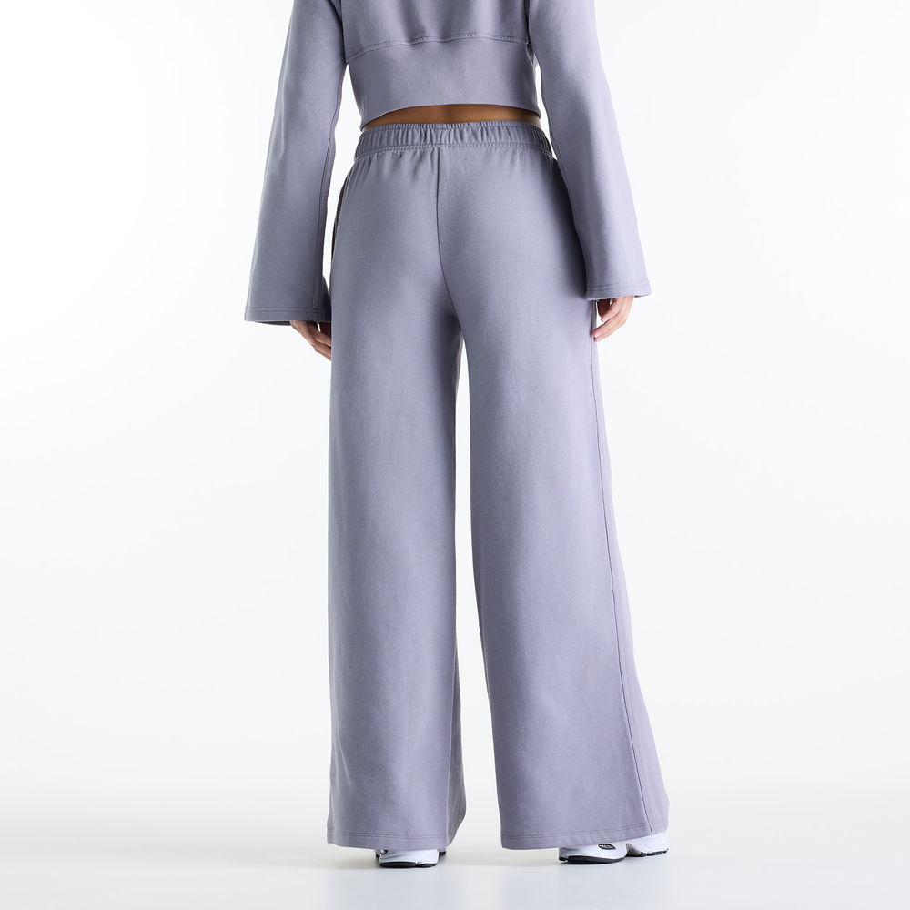 Dámske nohavice New Balance Brushed Coastal – fialové