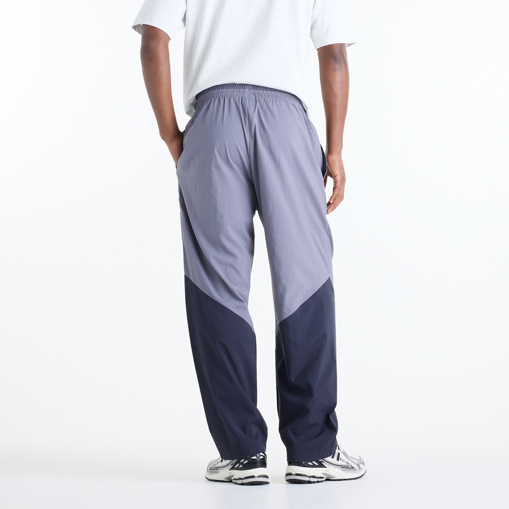 Pánske nohavice New Balance Sport Legacy – fialové