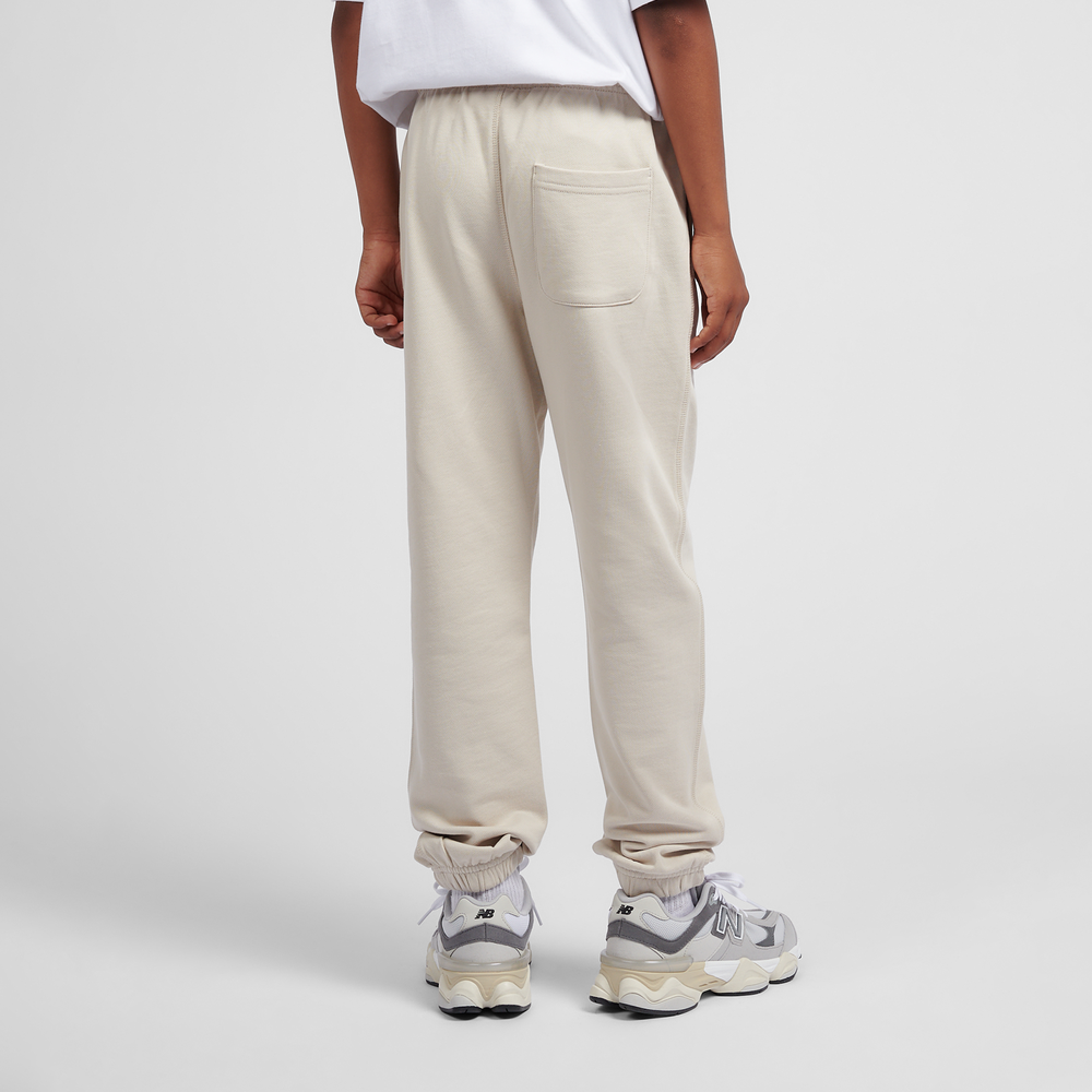 Detské nohavice New Balance LAKB0060TWF – béžové