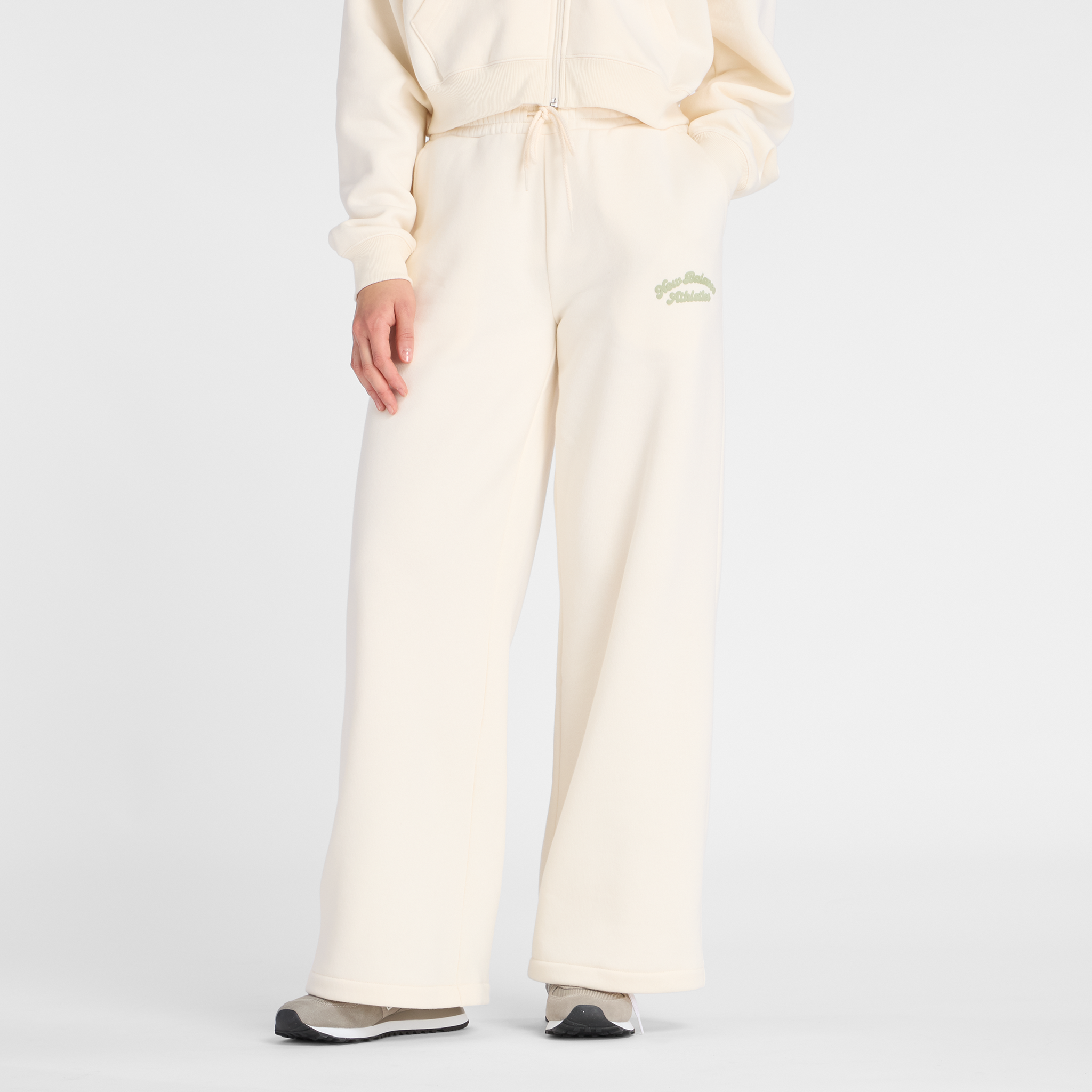 Dámske nohavice New Balance WP53902PEF – béžové