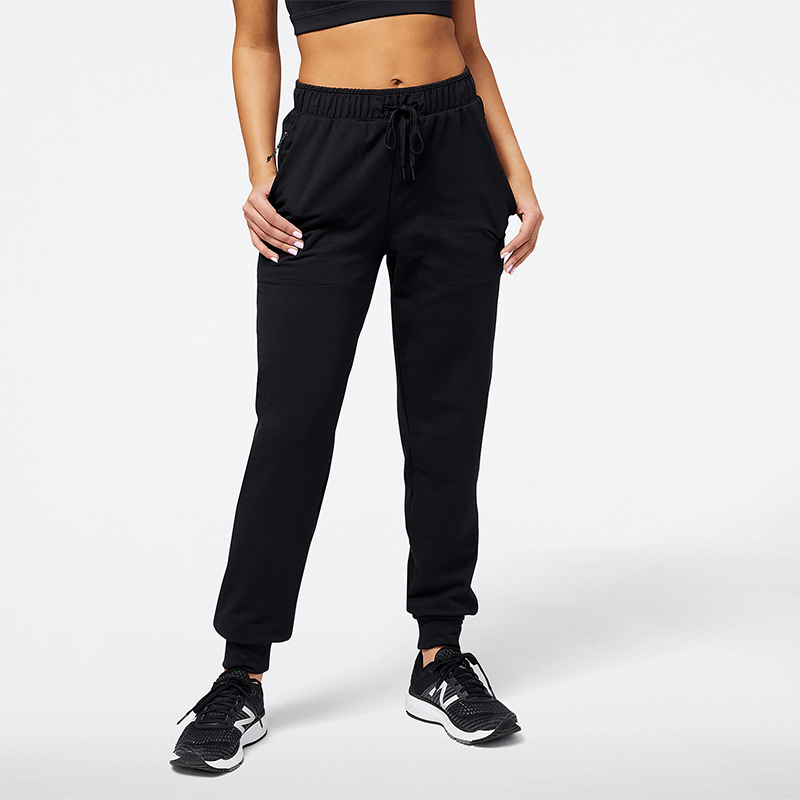 

Nohavice New Balance WP23287BK – čierne