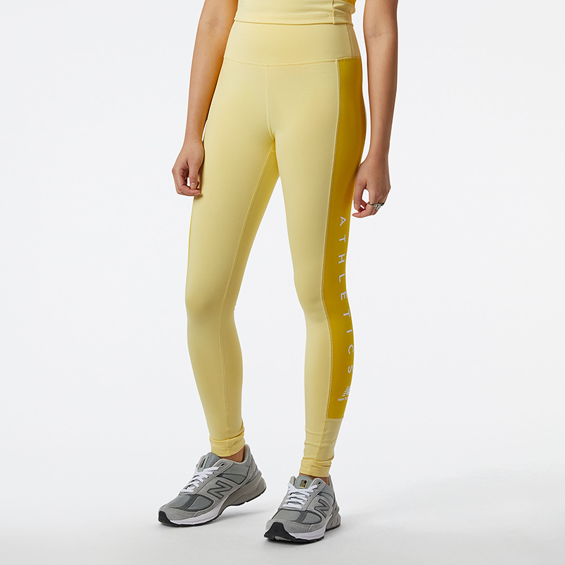 

Nohavice New Balance WP23501HCM – žlté